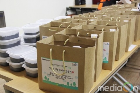 KMI 한국의학연구소, 어려운 이웃에 도시락 전달